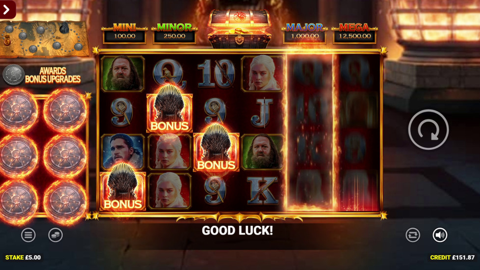 Game of Thrones slot base game showing cash value collect symbols and house sigils across the reels