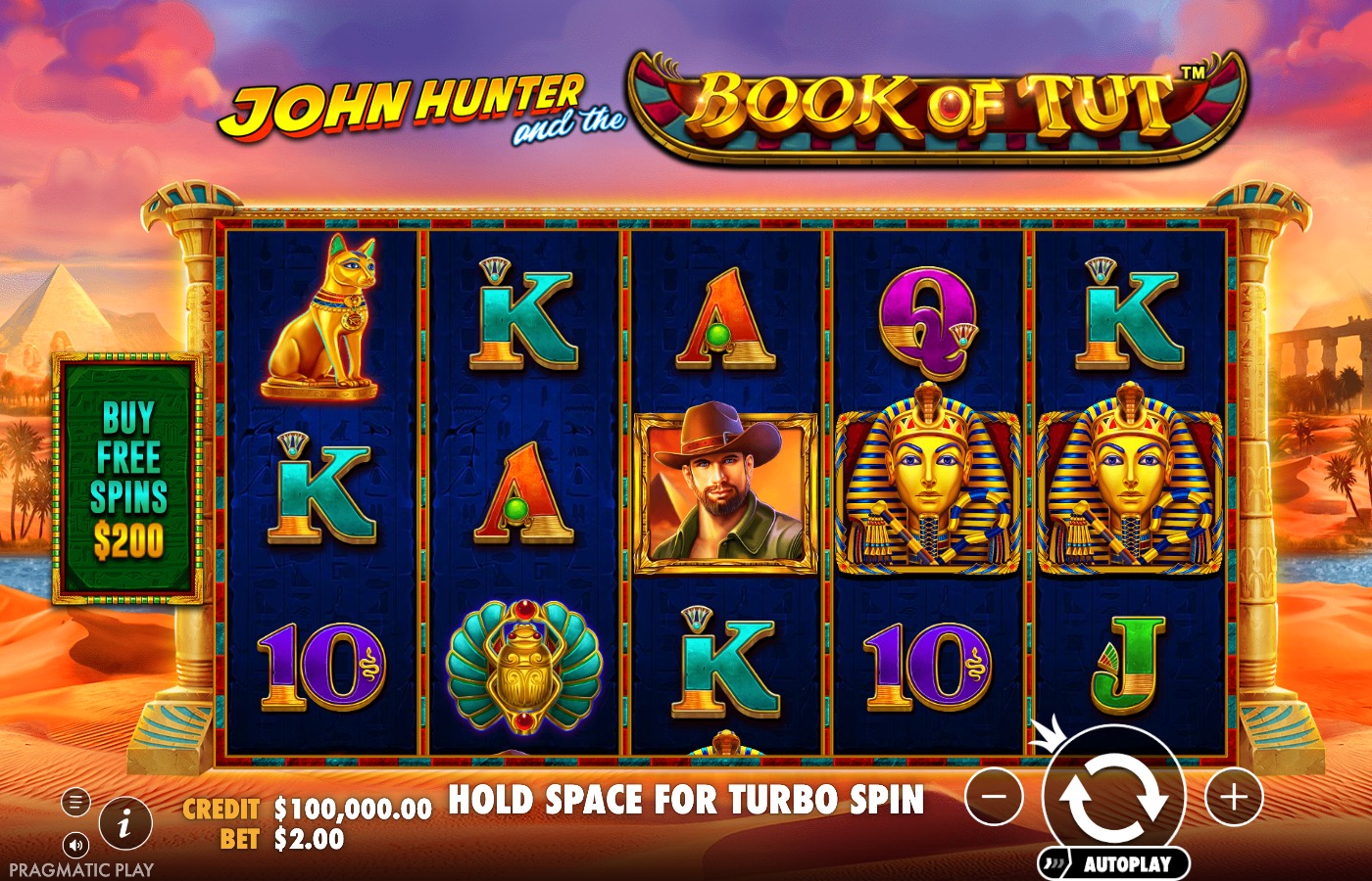John Hunter and the Book of Tut base game reels showing card-royal symbols, the John Hunter symbol and a Buy Free Spins banner