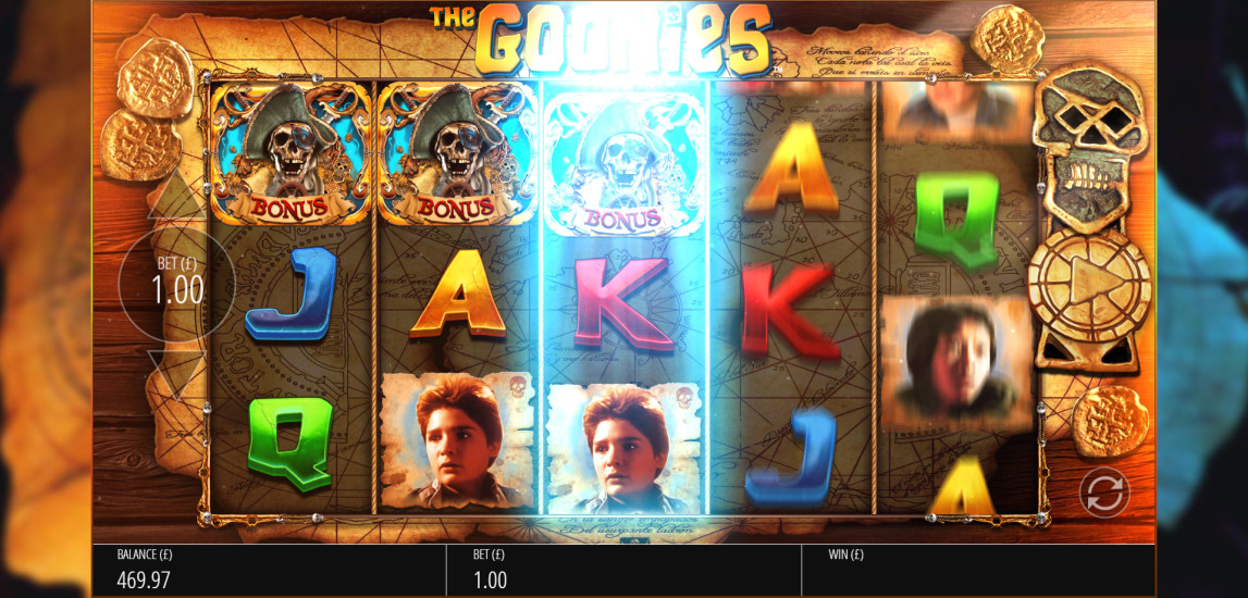 The Goonies slot base game showing a modifier triggering with a glowing skeleton key symbol