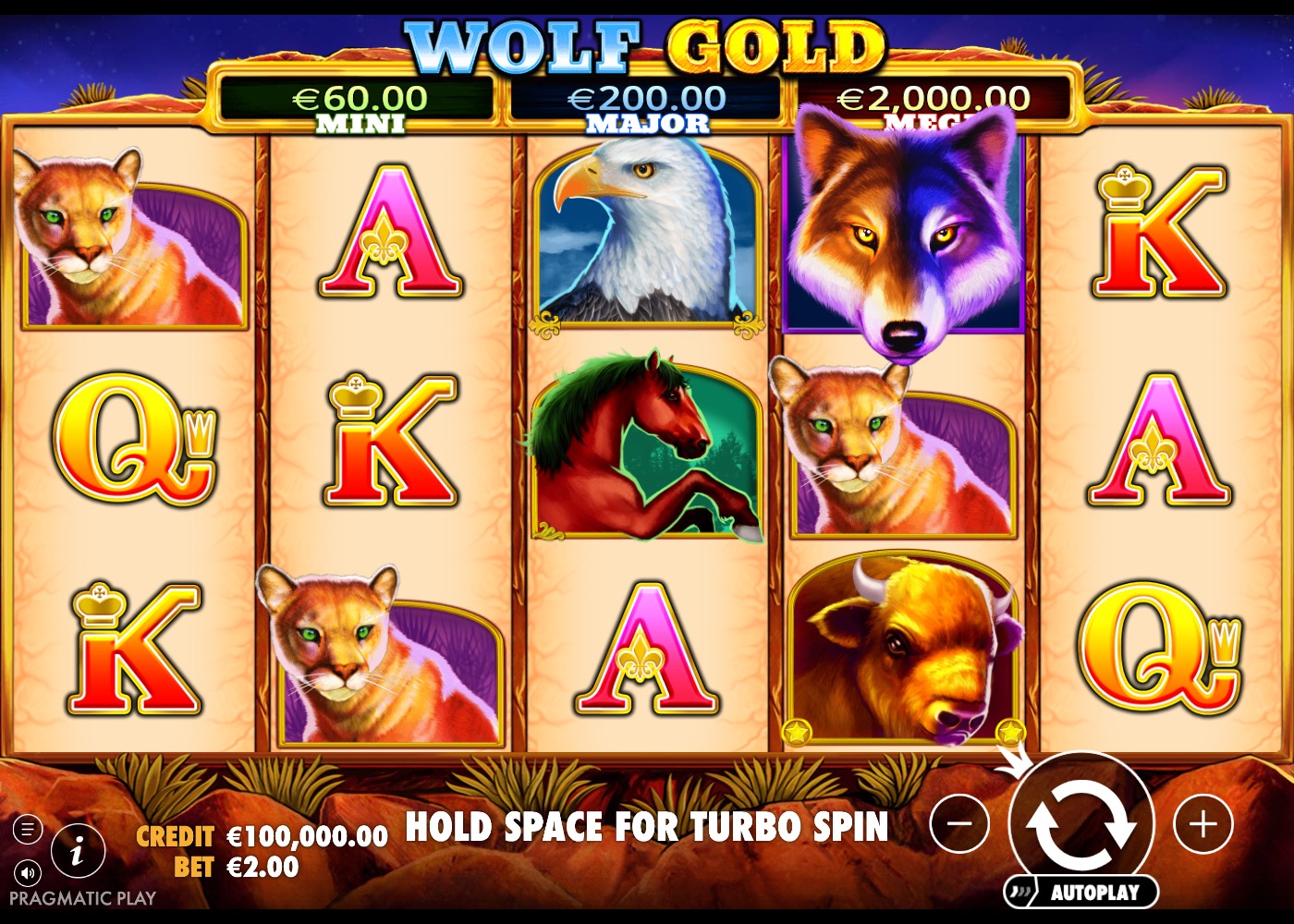 Wolf Gold base game reels showing the wolf wild symbol, bald eagle, cougar and card symbols across the 5x3 grid with the Mini, Major and Mega jackpot bar above